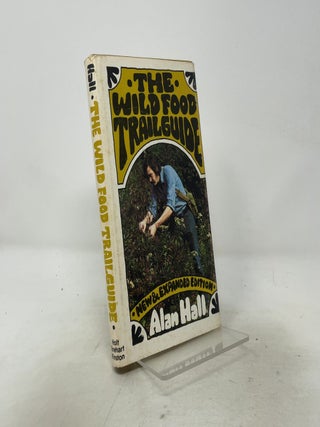 Item #556423 The wild food trailguide. Alan Hall